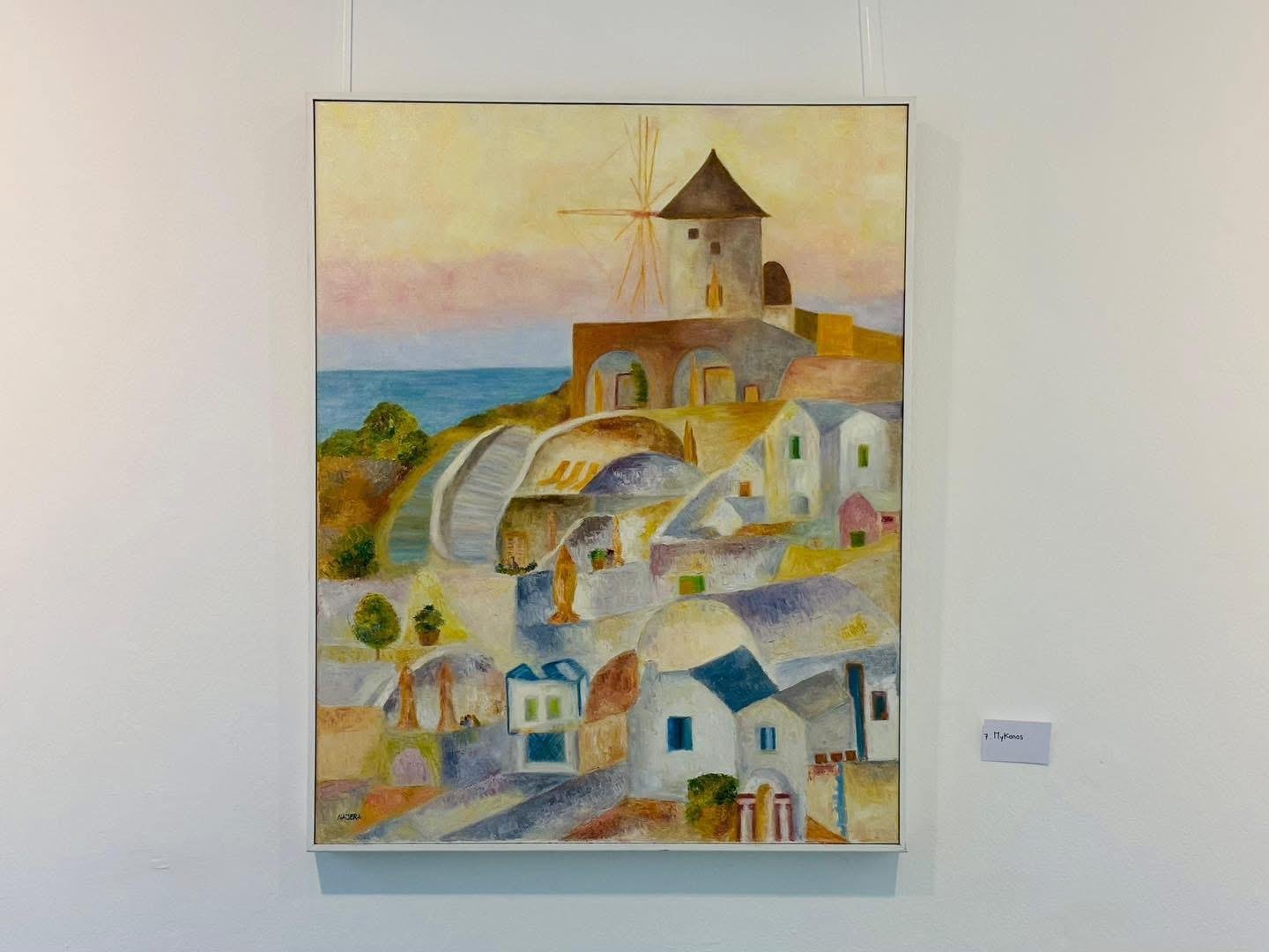 Óleo de un molino de viento en Míkonos contra un cielo rosado al atardecer.